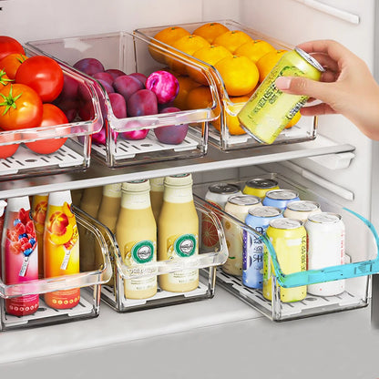 Clear fridge produce bins with removable drain trays holding fruit and drinks.