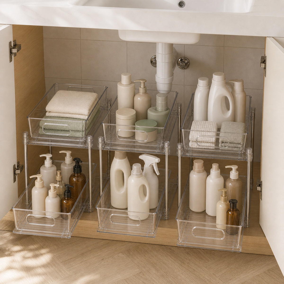 Both clear drawers filled with bathroom supplies to show capacity