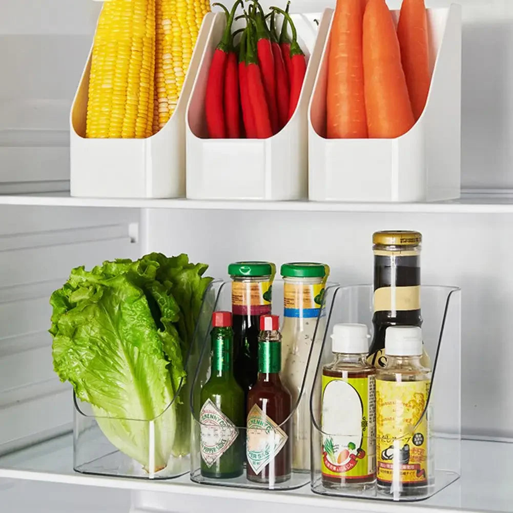 Clear and white compact organiser bins holding vegetables and condiments inside a fridge