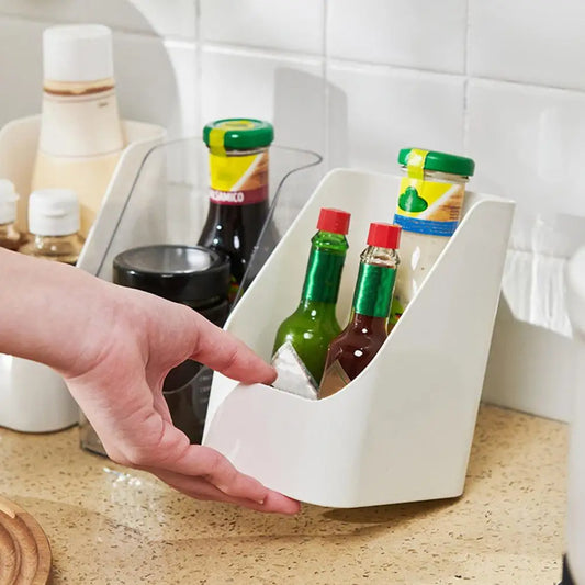 White compact organiser bin holding condiment bottles on a kitchen bench