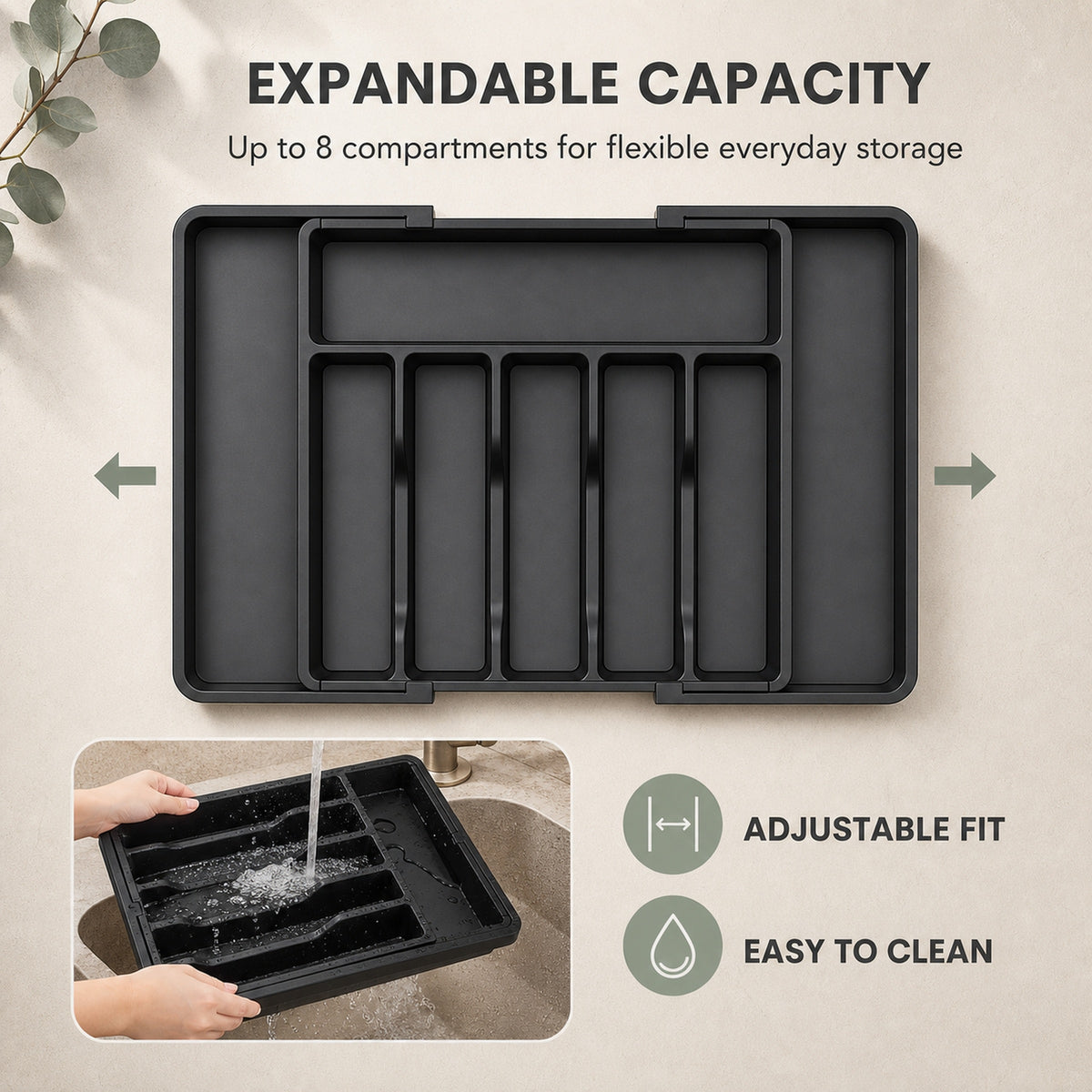 The cutlery tray shown expanded, with utensils filling the widened side compartments