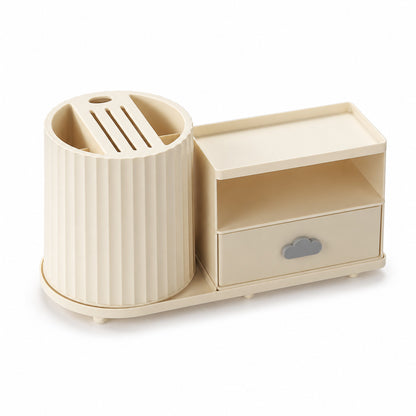One warm-cream rotating kitchen countertop organiser with a fluted utensil holder, slotted knife insert, open shelf and lower drawer on a white background