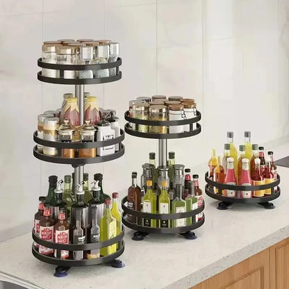 Black rotating tiered pantry organiser displaying bottles and jars