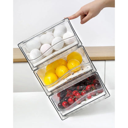 Three clear stackable fridge drawers arranged vertically with fruit and produce