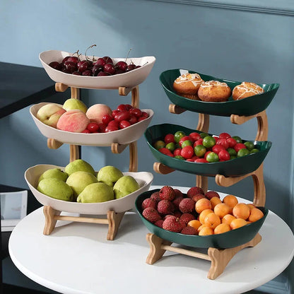 Beige and green tiered produce stands displaying fruit and pastries